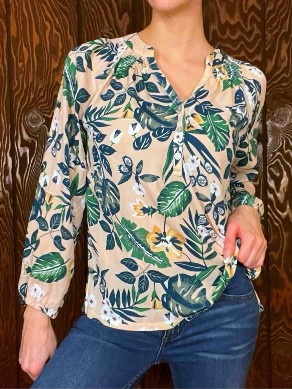 Tropical print peach blouse with green monstera leaves